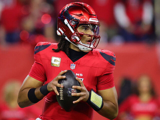 HOUSTON, TEXAS - NOVEMBER 10: C.J. Stroud #7 of the Houston Texans steps back to pass during the third quarter against the Detroit Lions at NRG Stadium on November 10, 2024 in Houston, Texas.