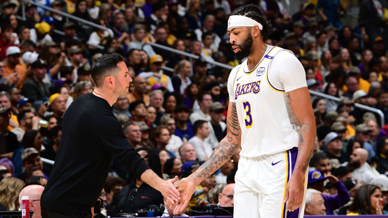 LOS ANGELES, CA - NOVEMBER 10: Anthony Davis #3 and Head Coach JJ Redick of the Los Angeles Lakers high five during the game against the Toronto Raptors on November 10, 2024 at Crypto.Com Arena in Los Angeles, California. NOTE TO USER: User expressly acknowledges and agrees that, by downloading and/or using this Photograph, user is consenting to the terms and conditions of the Getty Images License Agreement. Mandatory Copyright Notice: Copyright 2024 NBAE