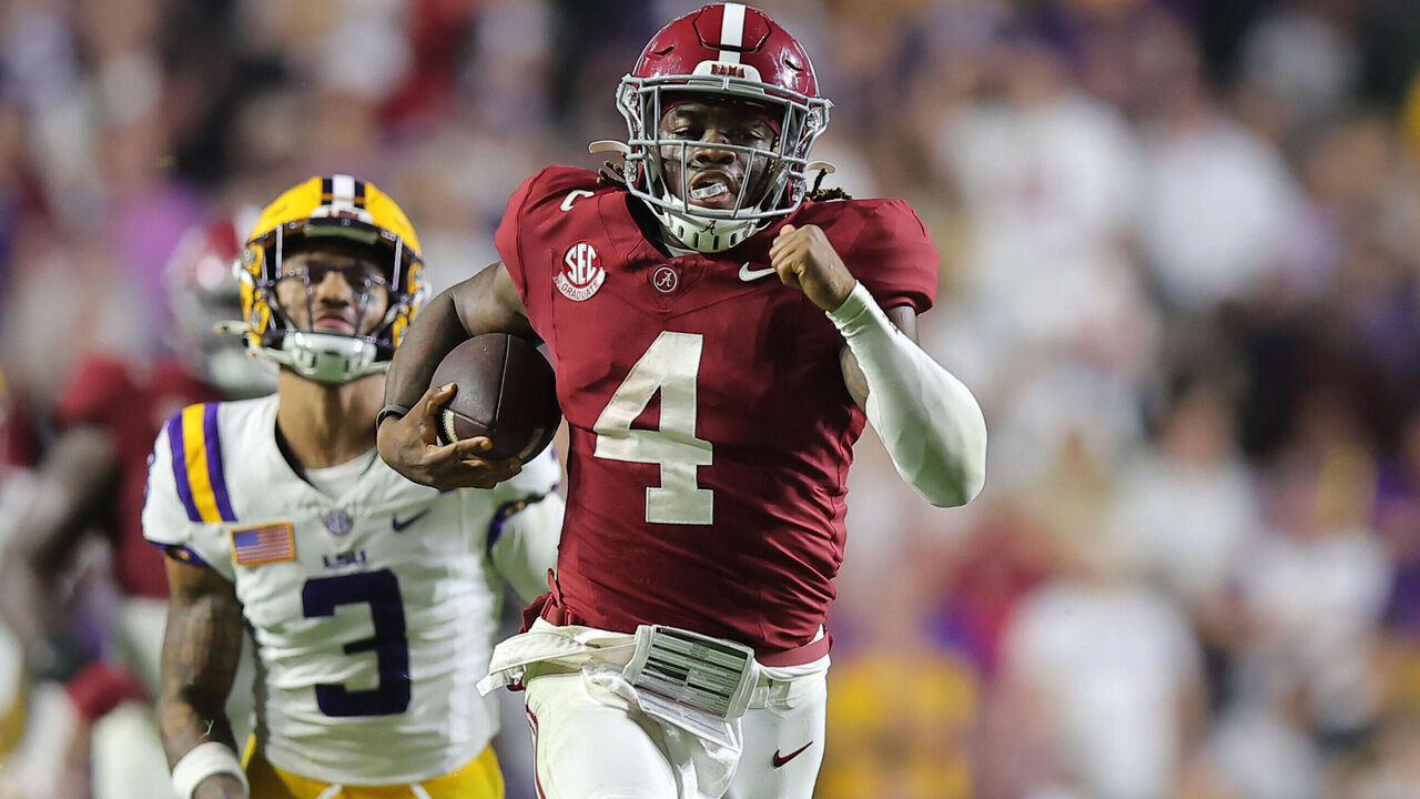 BATON ROUGE, LOUISIANA - NOVEMBER 09: Jalen Milroe #4 of the Alabama Crimson Tide rushes for a touchdown as Sage Ryan #3 of the LSU Tigers defends during the second half at Tiger Stadium on November 09, 2024 in Baton Rouge, Louisiana.