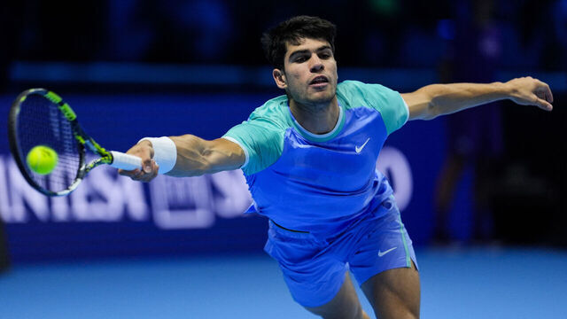 TURIN, ITALY - NOVEMBER 11: Carlos Alcaraz of Spain plays a forehand in the Men's Singles Round Robin match against Casper Ruud of Norway during day two of the Nitto ATP finals 2024 at Inalpi Arena on November 11, 2024 in Turin, Italy.