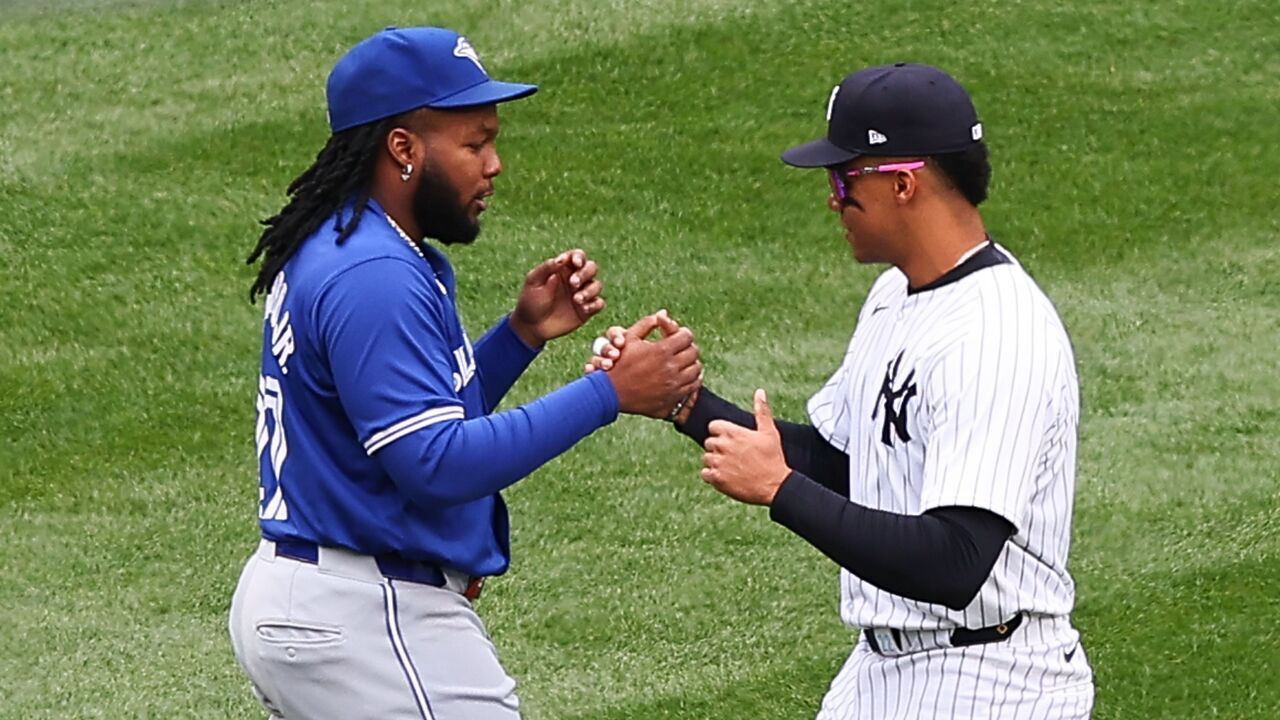 BRONX, NY - APRIL 05: Juan Soto #22 of the New York Yankees and Vladimir Guerrero Jr. #27 of the Toronto Blue Jays talk in the outfield prior to the game on April 5, 2024 at Yankee Stadium in the Bronx, New York.