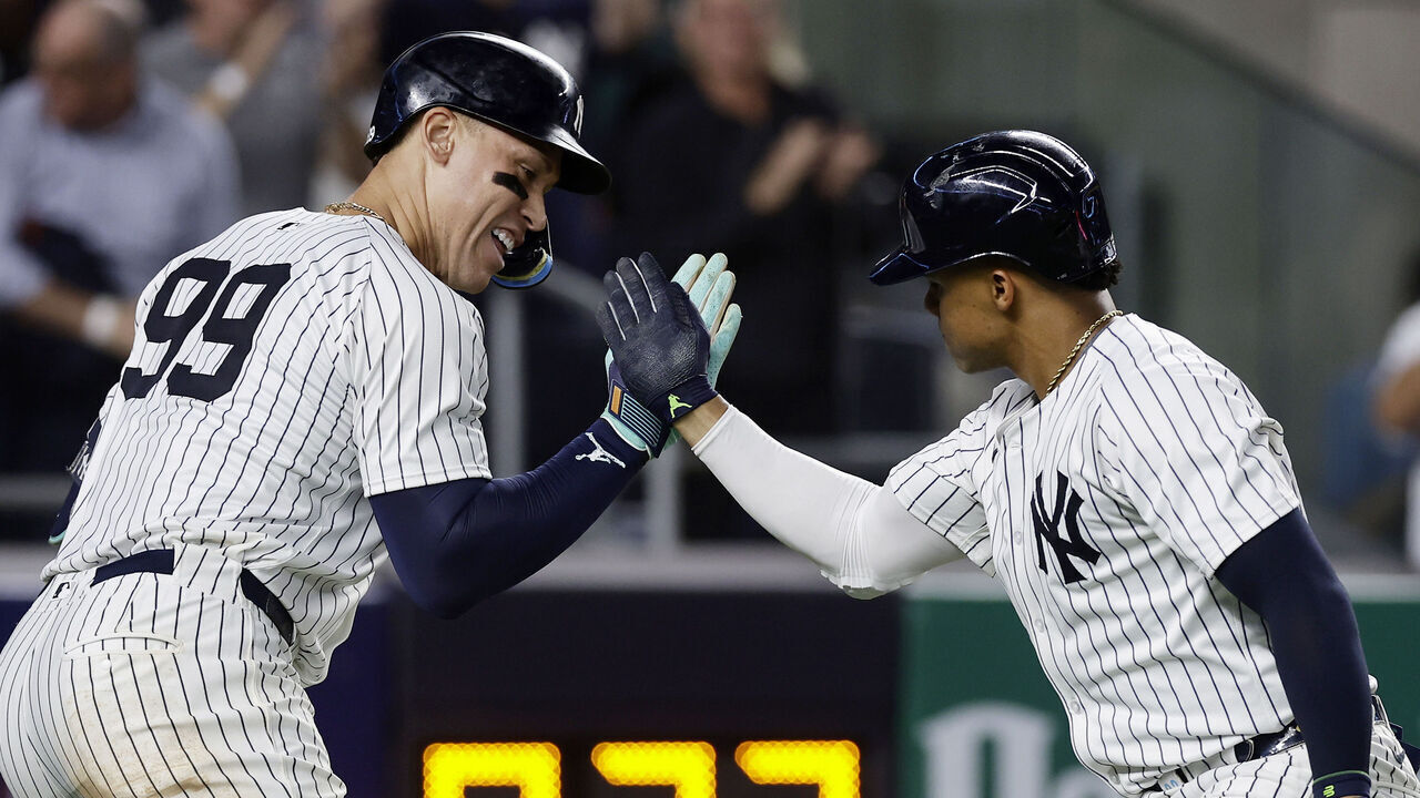 NEW YORK, NEW YORK - SEPTEMBER 11: Juan Soto #22 of the New York Yankees celebrates his sixth inning two run home run against the Kansas City Royals with teammate Aaron Judge #99 at Yankee Stadium on September 11, 2024 in New York City.