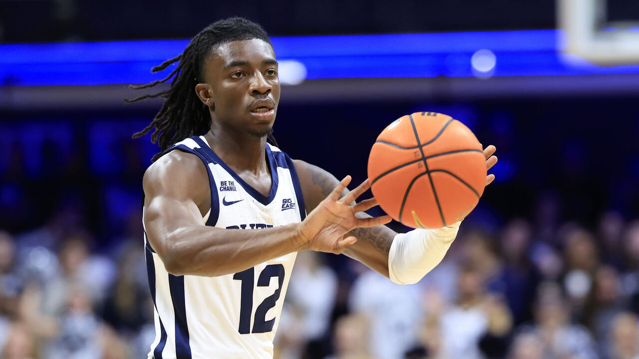INDIANAPOLIS, INDIANA - NOVEMBER 11: Kolby King #12 of the Butler Bulldogs passes the ball during the first half against the Western Michigan Broncos at Hinkle Fieldhouse on November 11, 2024 in Indianapolis, Indiana.