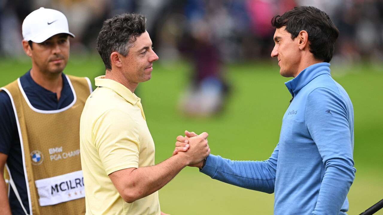 VIRGINIA WATER, ENGLAND - SEPTEMBER 22: Rory McIlroy of Northern Ireland and Matteo Manassero of Italy shake hands on the 18th green during day four of the BMW PGA Championship 2024 at Wentworth Club on September 22, 2024 in Virginia Water, England.