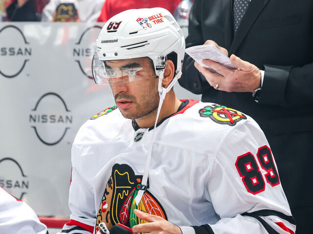 WINNIPEG, CANADA - OCTOBER 11: Andreas Athanasiou #89 of the Chicago Blackhawks looks on from the bench prior to puck drop against the Winnipeg Jets at the Canada Life Centre on October 11, 2024 in Winnipeg, Manitoba, Canada.
