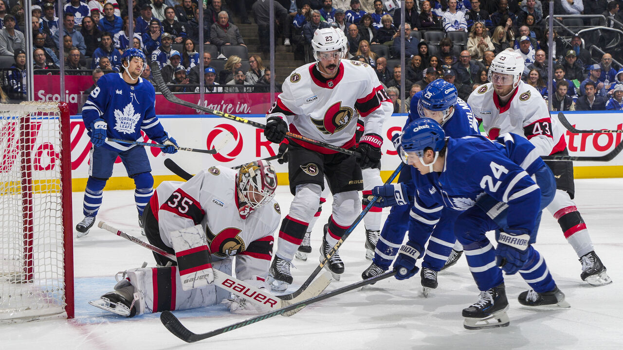 TORONTO, ON - NOVEMBER 12: Linus Ullmark #35 of the Ottawa Senators makes a save as Connor Dewar #24 of the Toronto Maple Leafs goes to the net during the first period at Scotiabank Arena on November 12, 2024 in Toronto, Ontario, Canada.