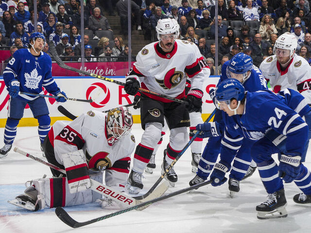 TORONTO, ON - NOVEMBER 12: Linus Ullmark #35 of the Ottawa Senators makes a save as Connor Dewar #24 of the Toronto Maple Leafs goes to the net during the first period at Scotiabank Arena on November 12, 2024 in Toronto, Ontario, Canada.