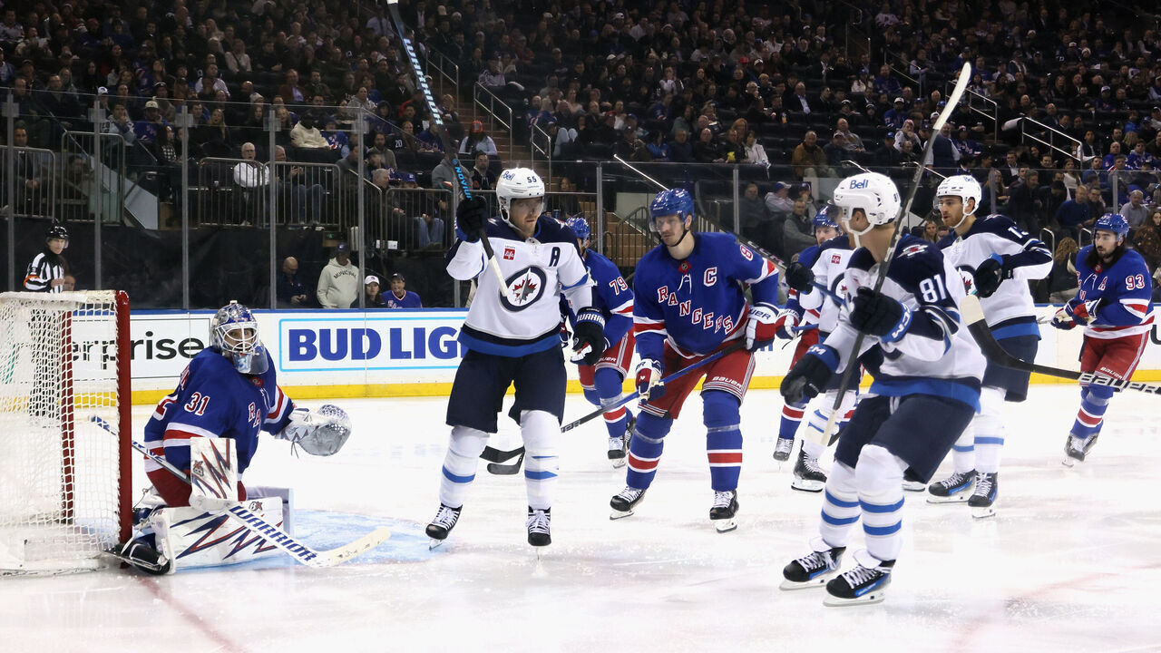 NEW YORK, NEW YORK - NOVEMBER 12: Mark Scheifele #55 of the Winnipeg Jets scores a third period goal against Igor Shesterkin #31 of the New York Rangers at Madison Square Garden on November 12, 2024 in New York City. The Jets defeated the Rangers 6-3.