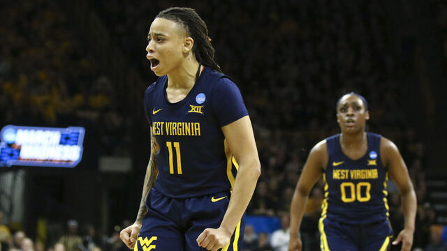 IOWA CITY, IOWA- MARCH 25: Guard J.J. Quinerly #11 of the West Virginia Mountaineers celebrates after a basket in the second half against the Iowa Hawkeyes during their second round match-up in the 2024 NCAA Division 1 Womens Basketball Championship at Carver-Hawkeye Arena on March 25, 2024 in Iowa City, Iowa.