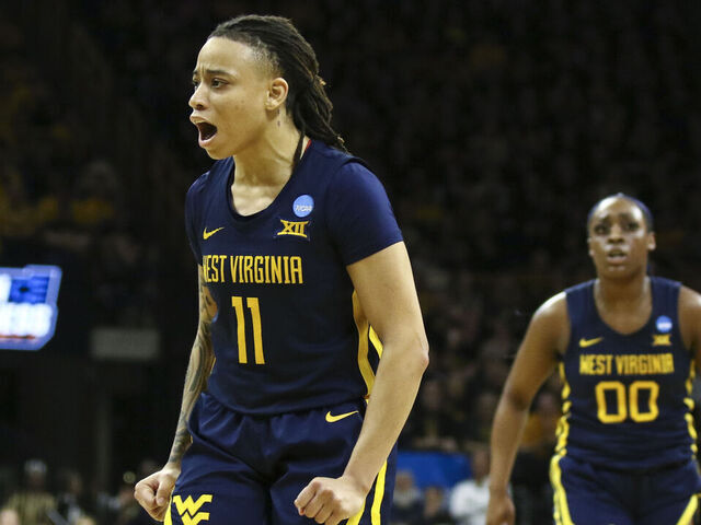 IOWA CITY, IOWA- MARCH 25: Guard J.J. Quinerly #11 of the West Virginia Mountaineers celebrates after a basket in the second half against the Iowa Hawkeyes during their second round match-up in the 2024 NCAA Division 1 Womens Basketball Championship at Carver-Hawkeye Arena on March 25, 2024 in Iowa City, Iowa.