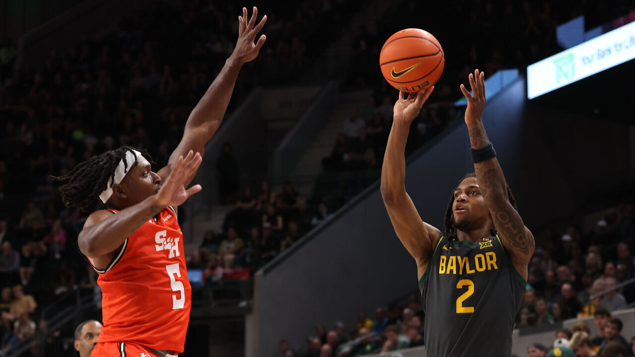 WACO, TEXAS - NOVEMBER 12: Jayden Nunn #2 of the Baylor Bears shoots over Marcus Boykin #5 of the Sam Houston State Bearkats at Foster Pavilion on November 12, 2024 in Waco, Texas.