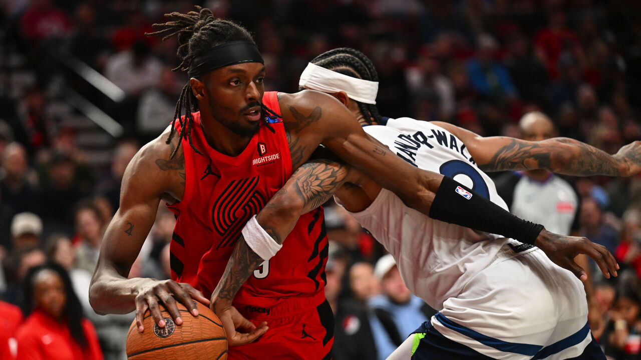 PORTLAND, OREGON - NOVEMBER 12: Jerami Grant #9 of the Portland Trail Blazers dribbles against Nickeil Alexander-Walker #9 of the Minnesota Timberwolves during the fourth quarter of the Emirates NBA Cup game at Moda Center on November 12, 2024 in Portland, Oregon. The Portland Trail Blazers won 122-108.