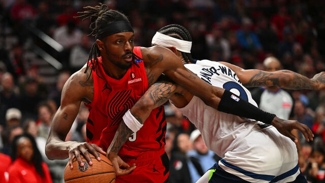 PORTLAND, OREGON - NOVEMBER 12: Jerami Grant #9 of the Portland Trail Blazers dribbles against Nickeil Alexander-Walker #9 of the Minnesota Timberwolves during the fourth quarter of the Emirates NBA Cup game at Moda Center on November 12, 2024 in Portland, Oregon. The Portland Trail Blazers won 122-108.