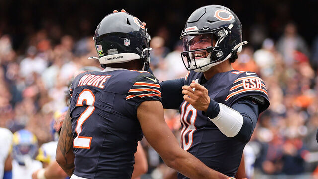CHICAGO, ILLINOIS - SEPTEMBER 29: DJ Moore #2 and Caleb Williams #18 of the Chicago Bears celebrate a touchdown against the Los Angeles Rams at Soldier Field on September 29, 2024 in Chicago, Illinois.