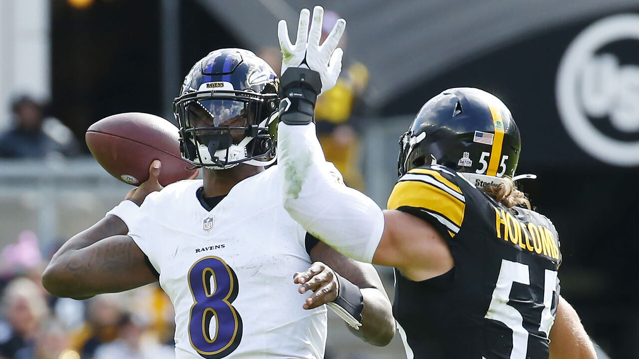 PITTSBURGH, PENNSYLVANIA - OCTOBER 08: Lamar Jackson #8 of the Baltimore Ravens attempts a pass while pressured by Cole Holcomb #55 of the Pittsburgh Steelers during the second quarter at Acrisure Stadium on October 08, 2023 in Pittsburgh, Pennsylvania.