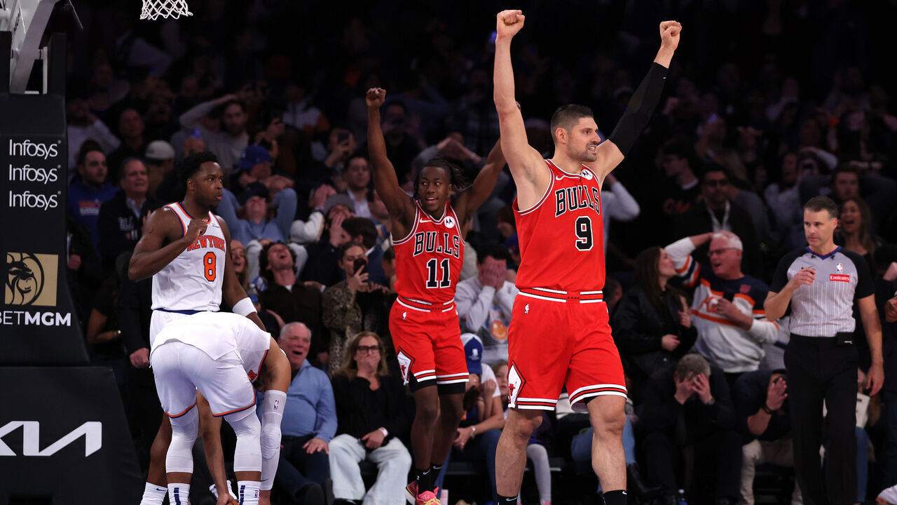 NEW YORK, NEW YORK - NOVEMBER 13: Nikola Vucevic #9 and Ayo Dosunmu #11 of the Chicago Bulls celebrate after their team defeated the New York Knicks at Madison Square Garden on November 13, 2024 in New York City.