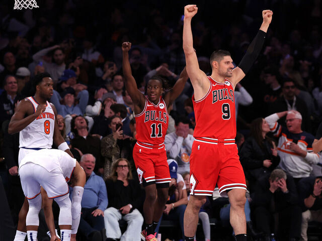 NEW YORK, NEW YORK - NOVEMBER 13: Nikola Vucevic #9 and Ayo Dosunmu #11 of the Chicago Bulls celebrate after their team defeated the New York Knicks at Madison Square Garden on November 13, 2024 in New York City.