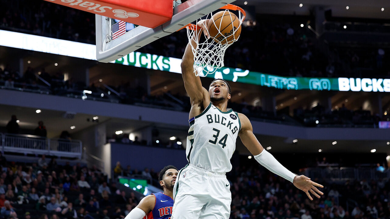 MILWAUKEE, WISCONSIN - NOVEMBER 13: Giannis Antetokounmpo #34 of the Milwaukee Bucks scores on a slam dunk during the first half of the game against the Detroit Pistons at Fiserv Forum on November 13, 2024 in Milwaukee, Wisconsin.