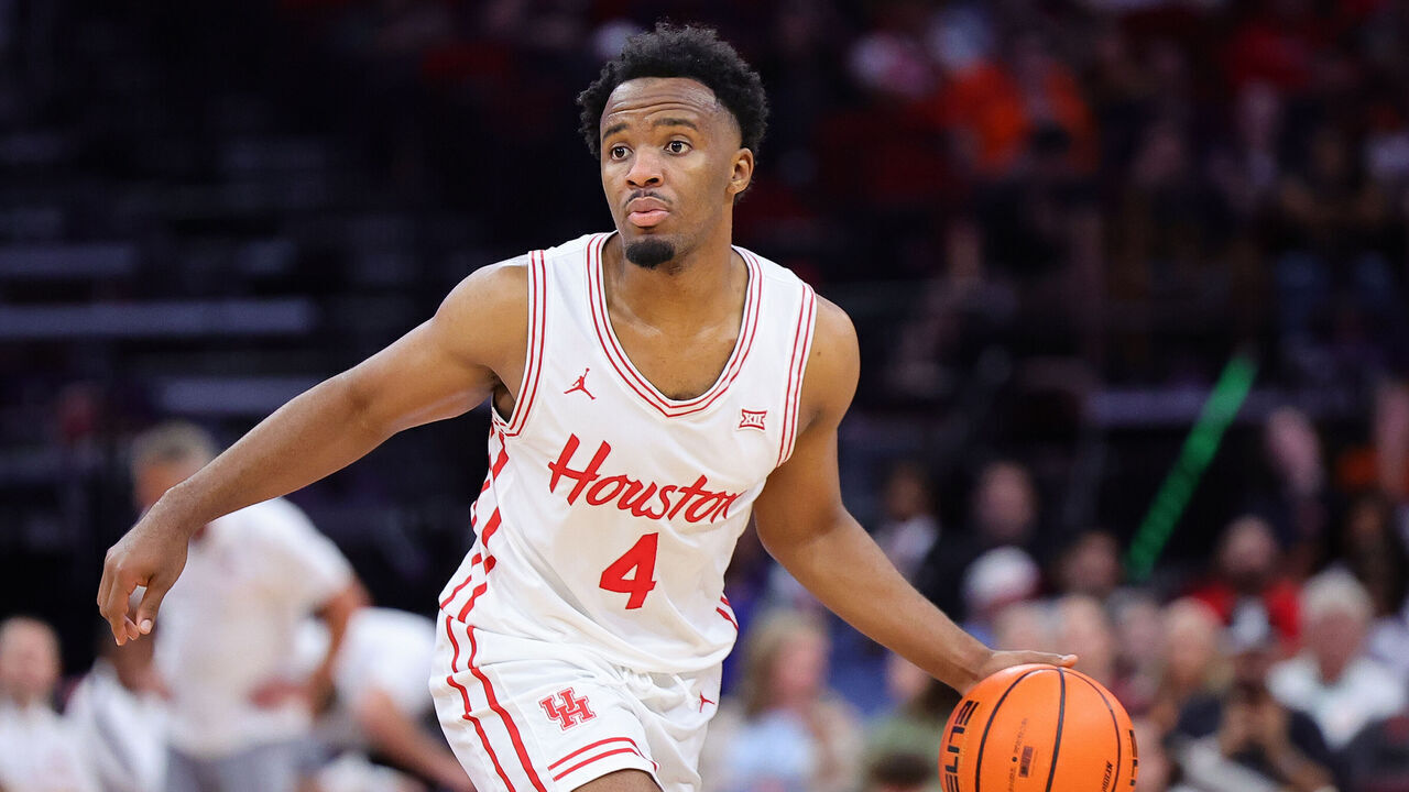 HOUSTON, TEXAS - NOVEMBER 09: L.J. Cryer #4 of the Houston Cougars drives against the Auburn Tigers during the second half of the Mattress Firm Battleground 2k24 at Toyota Center on November 09, 2024 in Houston, Texas.