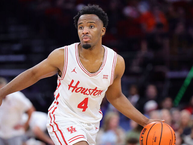HOUSTON, TEXAS - NOVEMBER 09: L.J. Cryer #4 of the Houston Cougars drives against the Auburn Tigers during the second half of the Mattress Firm Battleground 2k24 at Toyota Center on November 09, 2024 in Houston, Texas.