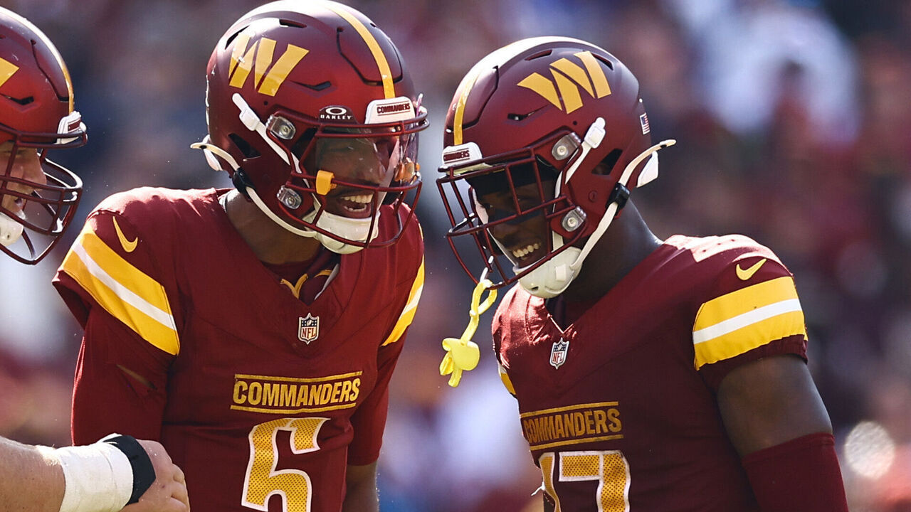 LANDOVER, MARYLAND - SEPTEMBER 15: Tyler Biadasz #63, Jayden Daniels #5 and Terry McLaurin #17 of the Washington Commanders react during the fourth quarter against the New York Giants at Northwest Stadium on September 15, 2024 in Landover, Maryland.