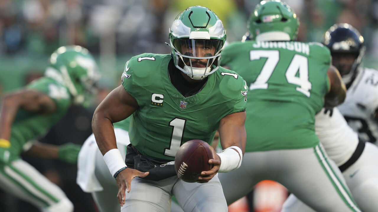 PHILADELPHIA, PA - NOVEMBER 03: Philadelphia Eagles quarterback Jalen Hurts (1) hands off the ball during the game between the Philadelphia Eagles and the Jacksonville Jaguars on November 3, 2024 at Lincoln Financial Field in Philadelphia, PA.