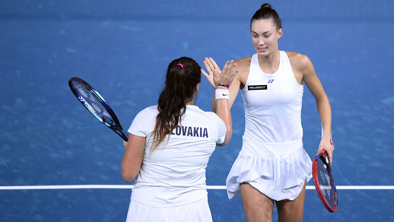 Viktoria Hruncakova (L) and Tereza Mihalikova, of team Slovakia, celebrate a point against Ashlyn Krueger and Taylor Townsend, of team USA, during their doubles tennis match between Slovakia and USA at the Billie Jean King Cup Finals at the Palacio de Deportes Jose Maria Martin Carpena in Malaga, Spain, on November 14, 2024.