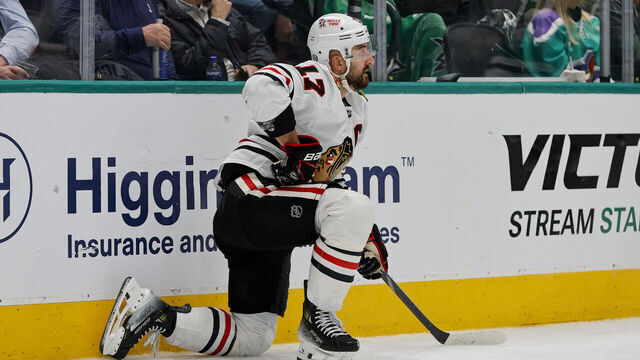 DALLAS, TX - NOVEMBER 07: Chicago Blackhawks left wing Nick Foligno (17) gets up after being into the boards during the game between the Dallas Stars and the Chicago Blackhawks on November 7, 2024 at American Airlines Center in Dallas, Texas.