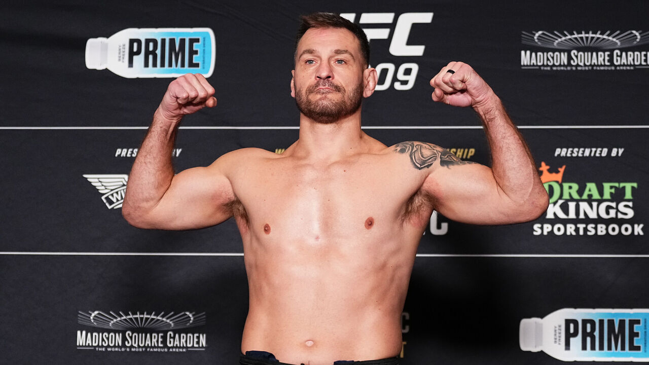 NEW YORK, NEW YORK - NOVEMBER 15: Stipe Miocic poses on the scale during the UFC 309 official weigh-in at the New York Hilton Midtown on November 15, 2024 in New York City.