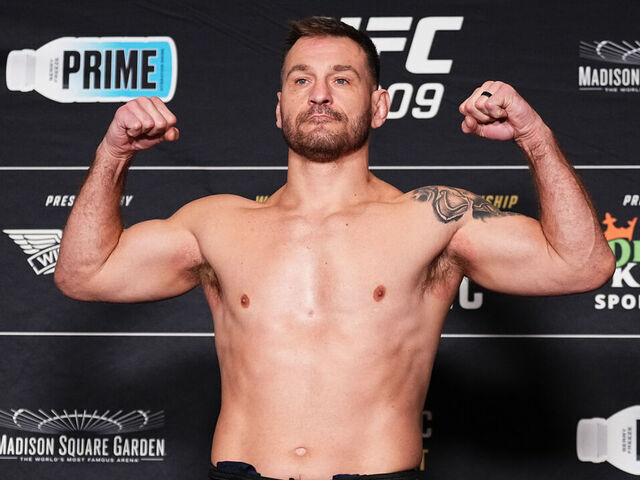 NEW YORK, NEW YORK - NOVEMBER 15: Stipe Miocic poses on the scale during the UFC 309 official weigh-in at the New York Hilton Midtown on November 15, 2024 in New York City.