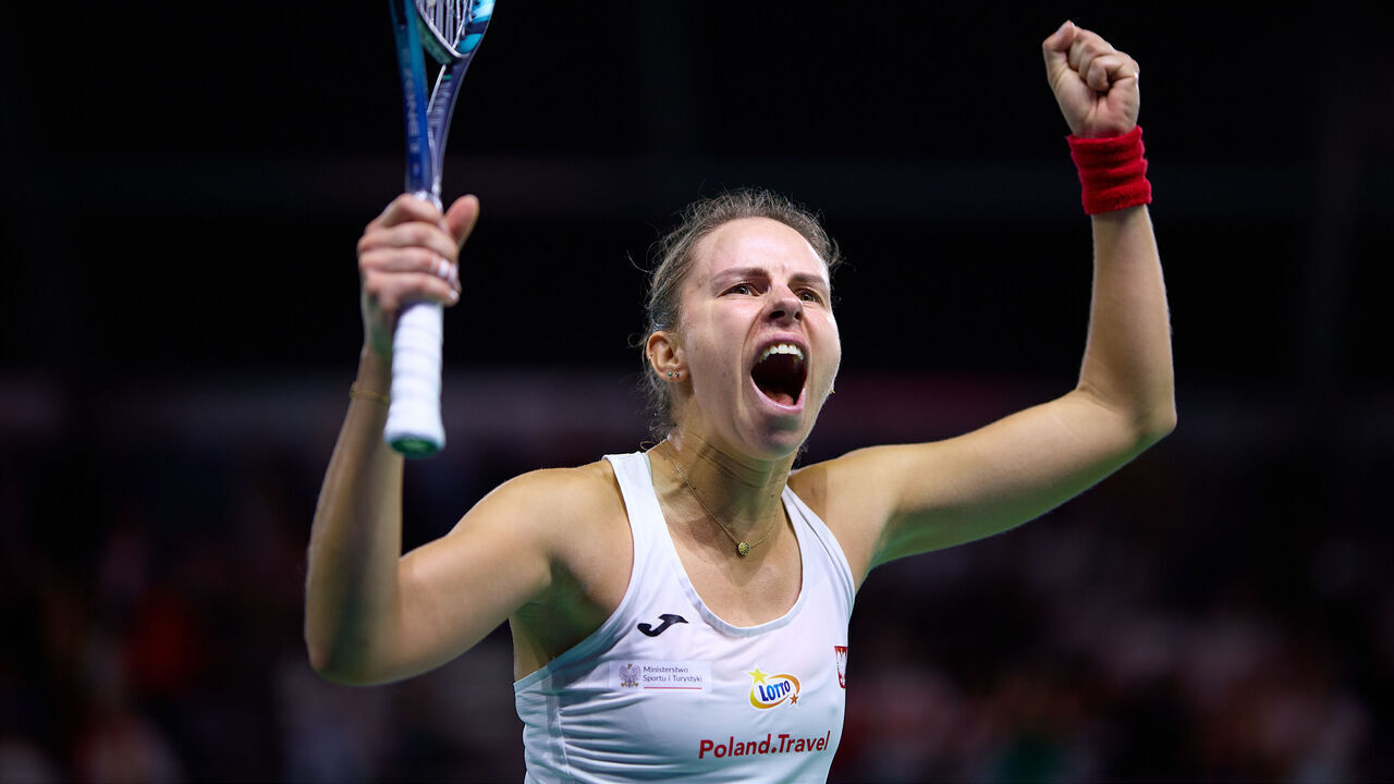MALAGA, SPAIN - NOVEMBER 15: Magda Linette of Team Poland celebrates after winning the the Billie Jean King Cup Finals match between Spain and Poland at Palacio de Deportes Jose Maria Martin Carpena on November 15, 2024 in Malaga, Spain.