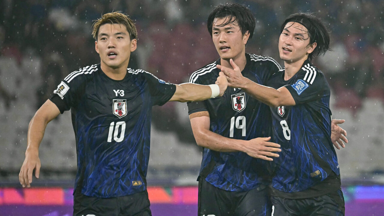 Japan's Koki Ogawa (C) celebrates with his teammates after scoring his team's first goal during the 2026 World Cup Asian Group C qualification football match between Indonesia and Japan at the Gelora Bung Karno Stadium in Jakarta on November 15, 2024.