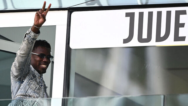 TOPSHOT - French forward Paul Pogba waves as he arrives to attend the Italian Serie A football match between Juventus and Cagliari at the Allianz stadium in Turin, on October 6, 2024.