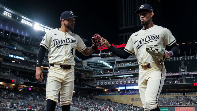 MINNEAPOLIS, MN - SEPTEMBER 26: Carlos Correa #4 looks on with Byron Buxton #25 against the Miami Marlins on September 26, 2024 at Target Field in Minneapolis, Minnesota.