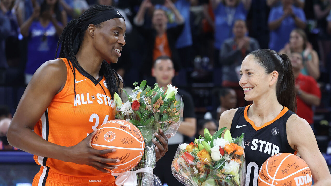 CHICAGO, IL - JULY 10: Sylvia Fowles #34 of Team Wilson and Sue Bird #10 of Team Stewart receive a bouquet and a signed basketball from their teammates during the 2022 AT&T WNBA All-Star Game on July 10, 2022 at Wintrust Arena in Chicago, Illinois. Mandatory Copyright Notice: Copyright 2022 NBAE