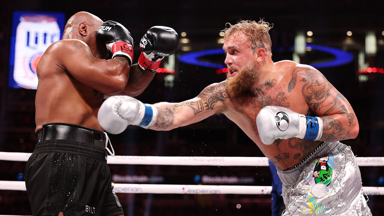 ARLINGTON, TEXAS - NOVEMBER 15: (L-R) Mike Tyson and Jake Paul fight during LIVE On Netflix: Jake Paul vs. Mike Tyson at AT&T Stadium on November 15, 2024 in Arlington, Texas.