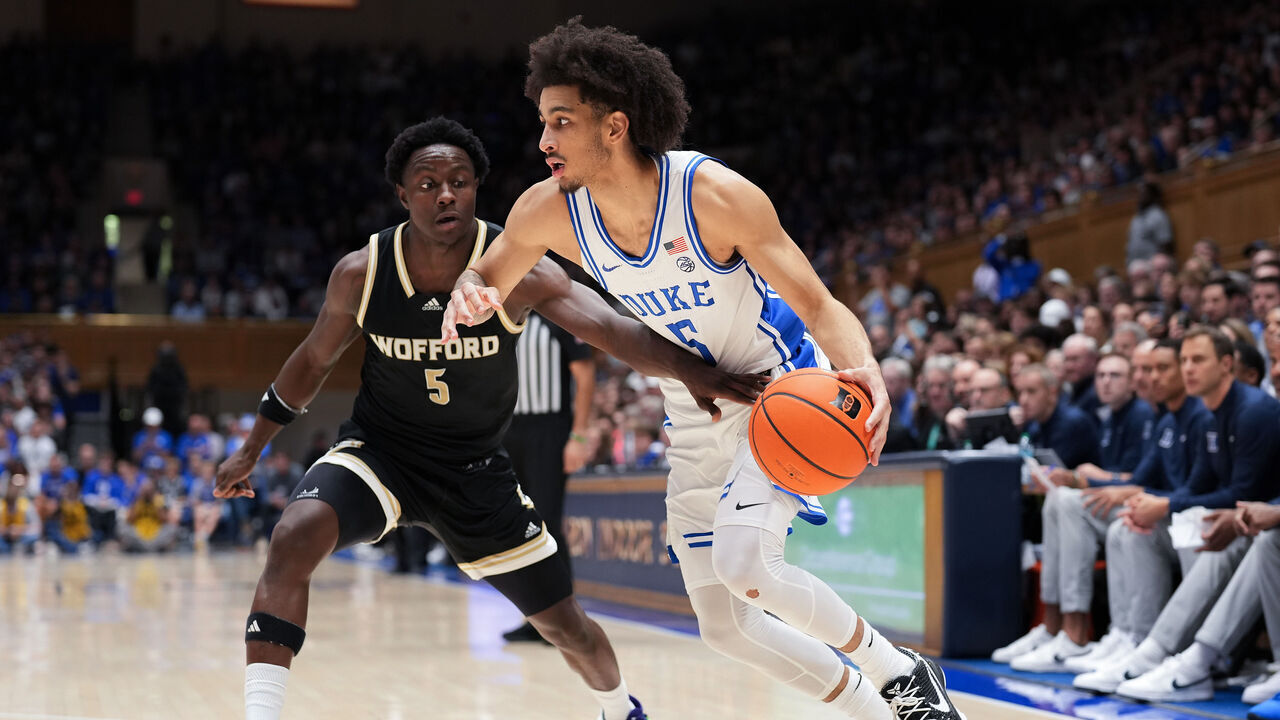 DURHAM, NORTH CAROLINA - NOVEMBER 16: Tyrese Proctor #5 of the Duke Blue Devils drives to the basket against Justin Bailey #5 of the Wofford Terriers during the second half of the game at Cameron Indoor Stadium on November 16, 2024 in Durham, North Carolina. The Blue Devils won 86-35.