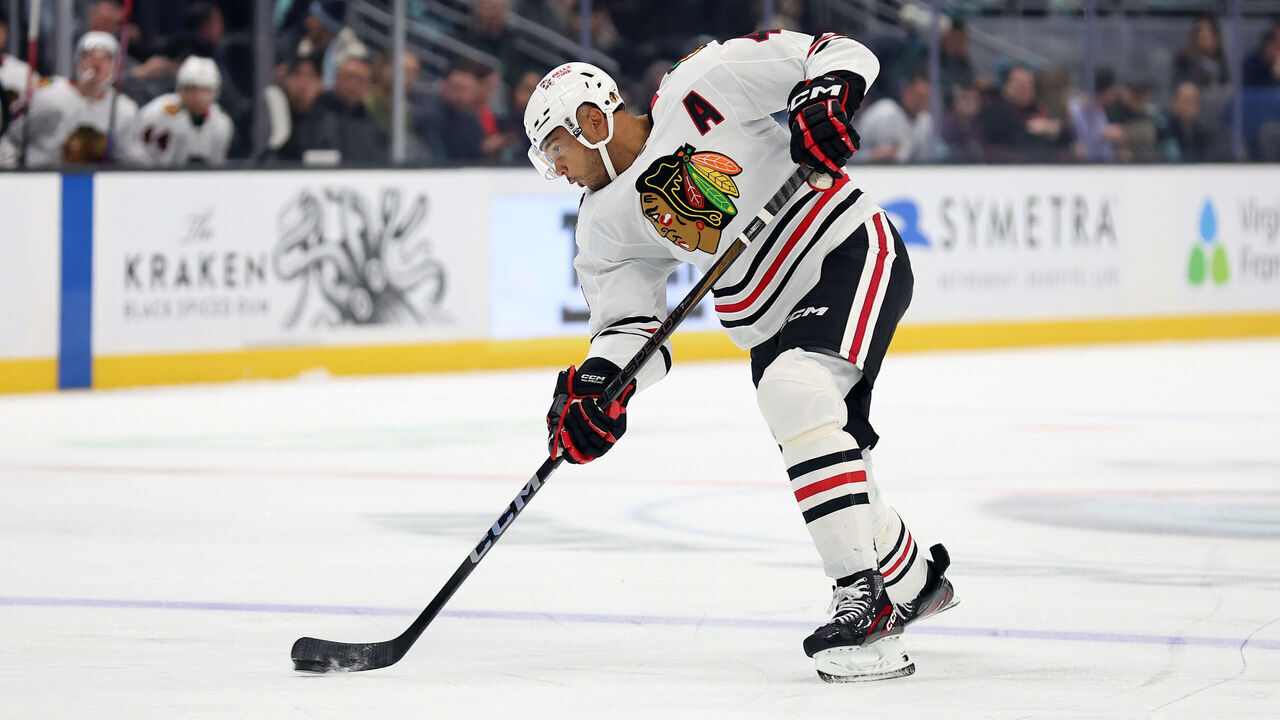 SEATTLE, WASHINGTON - NOVEMBER 14: Seth Jones #4 of the Chicago Blackhawks shoots against the Seattle Kraken during the first period at Climate Pledge Arena on November 14, 2024 in Seattle, Washington.