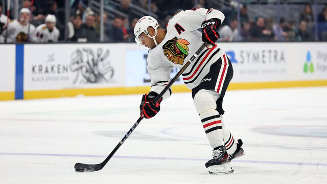 SEATTLE, WASHINGTON - NOVEMBER 14: Seth Jones #4 of the Chicago Blackhawks shoots against the Seattle Kraken during the first period at Climate Pledge Arena on November 14, 2024 in Seattle, Washington.