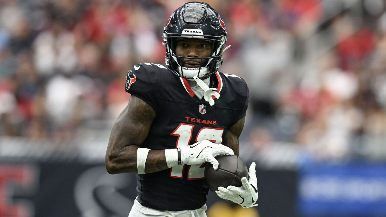 HOUSTON, TEXAS - SEPTEMBER 29: Nico Collins #12 of the Houston Texans runs after catching a pass during the second quarter of the game against the Jacksonville Jaguars at NRG Stadium on September 29, 2024 in Houston, Texas.