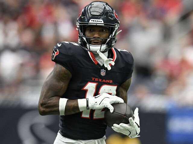 HOUSTON, TEXAS - SEPTEMBER 29: Nico Collins #12 of the Houston Texans runs after catching a pass during the second quarter of the game against the Jacksonville Jaguars at NRG Stadium on September 29, 2024 in Houston, Texas.