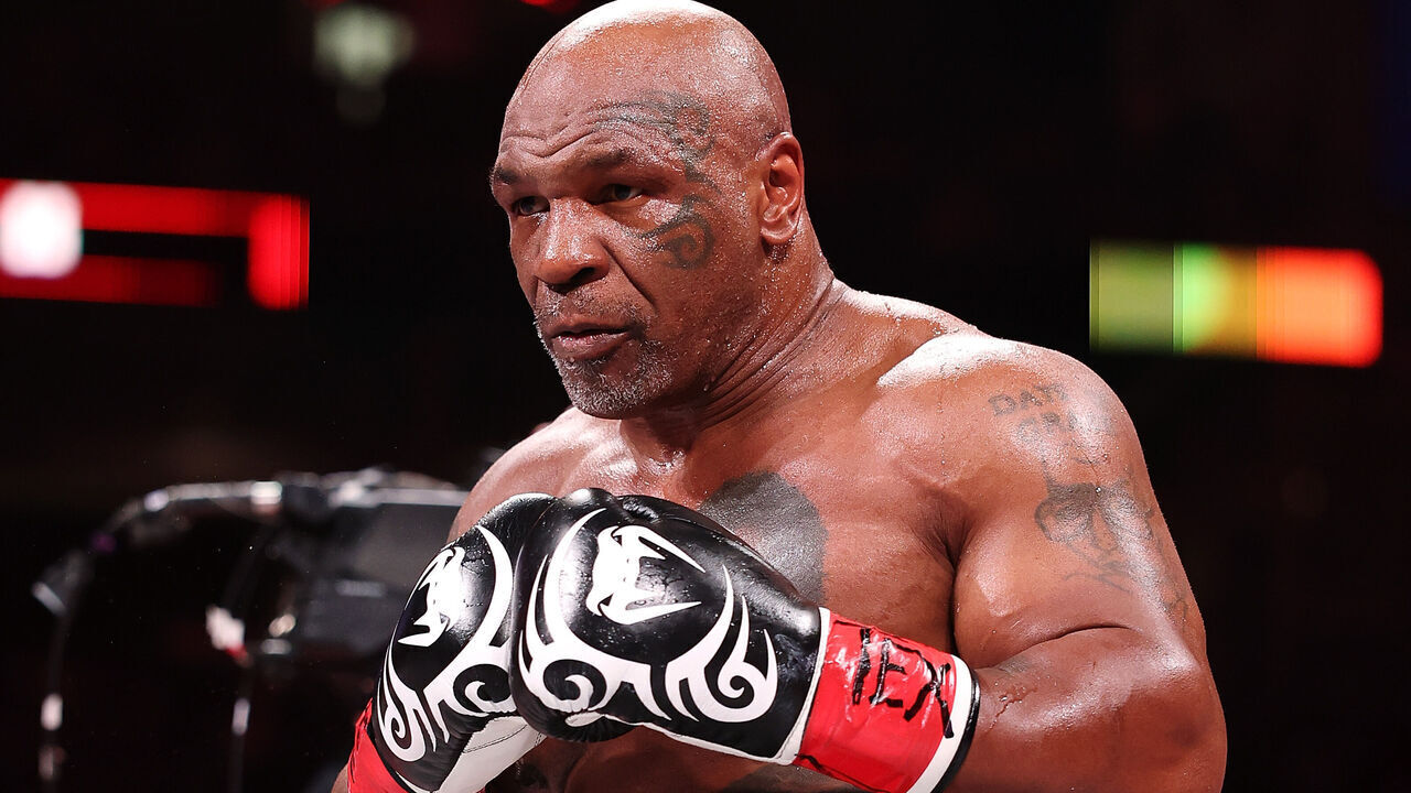 ARLINGTON, TEXAS - NOVEMBER 15: Mike Tyson fights during LIVE On Netflix: Jake Paul vs. Mike Tyson at AT&T Stadium on November 15, 2024 in Arlington, Texas.