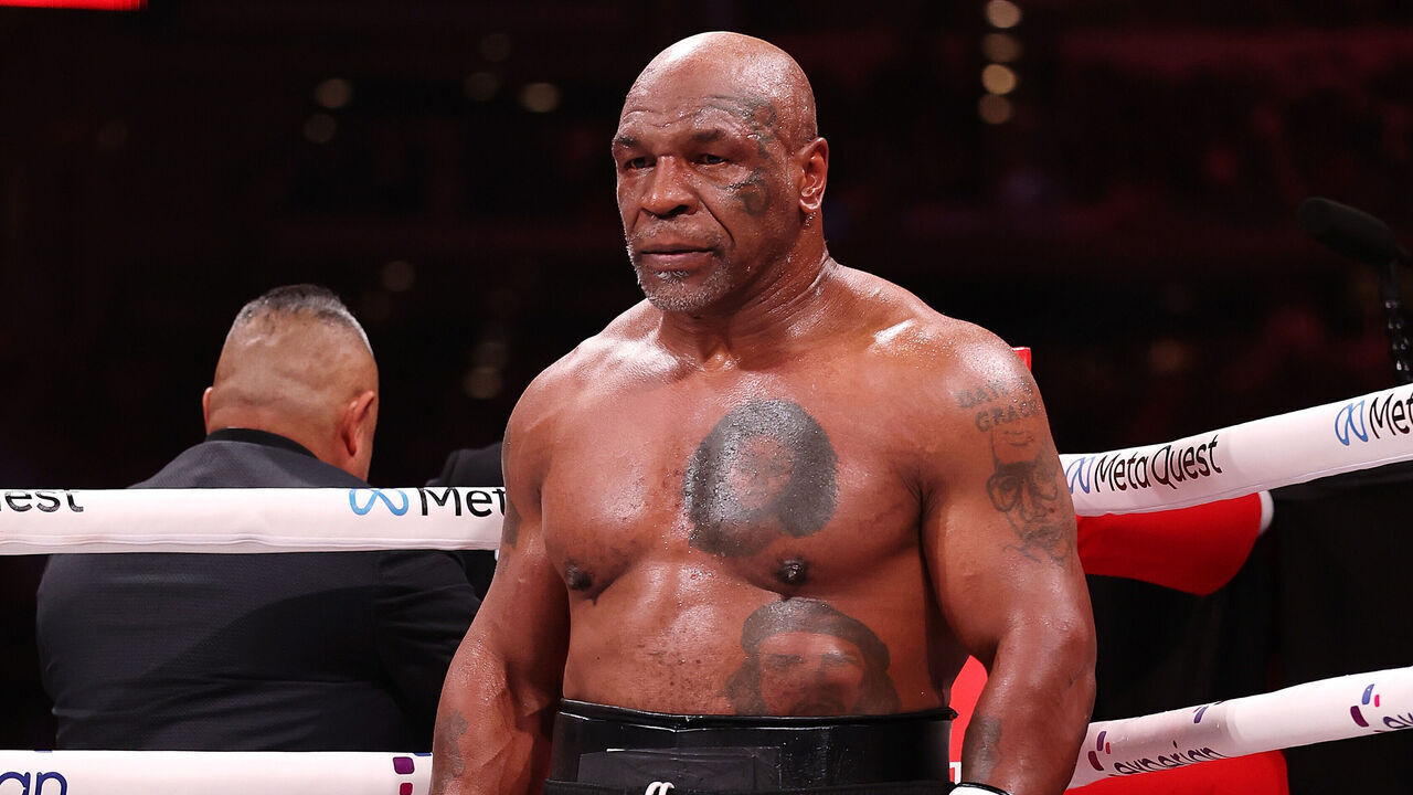 ARLINGTON, TEXAS - NOVEMBER 15: Mike Tyson fights during LIVE On Netflix: Jake Paul vs. Mike Tyson at AT&T Stadium on November 15, 2024 in Arlington, Texas.