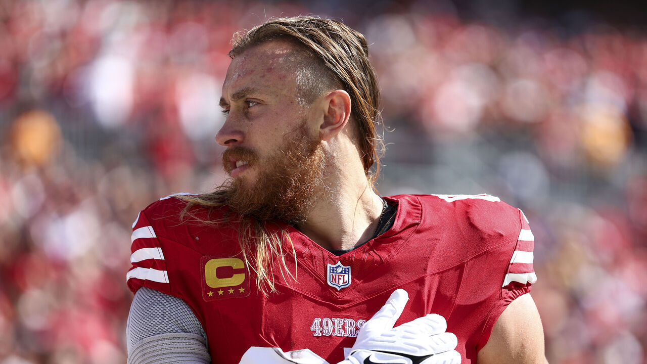 TAMPA, FLORIDA - NOVEMBER 10: George Kittle #85 of the San Francisco 49ers stands on the sidelines during the national anthem prior to an NFL football game against the Tampa Bay Buccaneers at Raymond James Stadium on November 10, 2024 in Tampa, Florida.