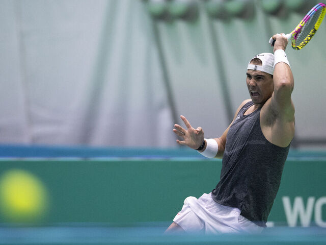 CORRECTION / Spain's tennis player Rafael Nadal plays a return during a training session ahead of the Davis Cup tennis tournament at the Martin Carpena sportshall, in Malaga, on November 16, 2024.