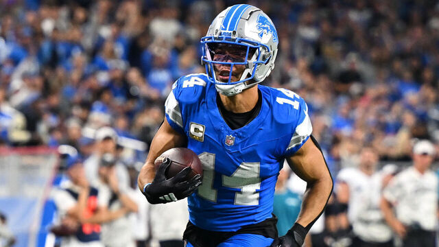 DETROIT, MI - NOVEMBER 17: Detroit Lions wide receiver Amon-Ra St. Brown (14) takes a reception in for a touchdown during the Detroit Lions versus the Jacksonville Jaguars game on Sunday November 17, 2024 at Ford Field in Detroit, MI.