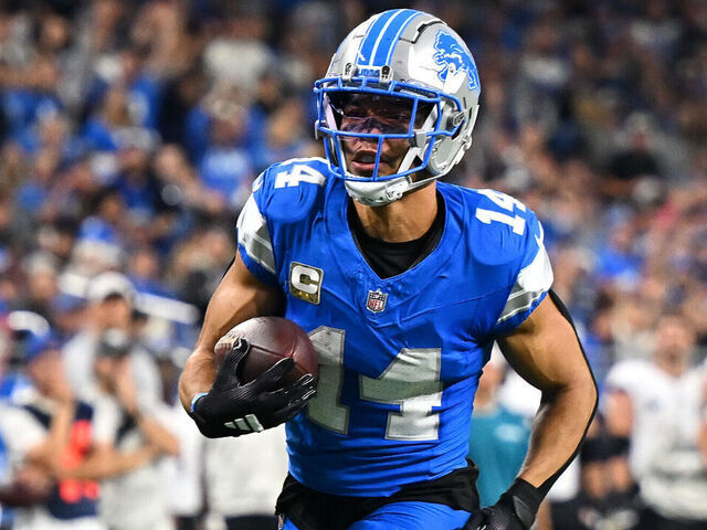 DETROIT, MI - NOVEMBER 17: Detroit Lions wide receiver Amon-Ra St. Brown (14) takes a reception in for a touchdown during the Detroit Lions versus the Jacksonville Jaguars game on Sunday November 17, 2024 at Ford Field in Detroit, MI.