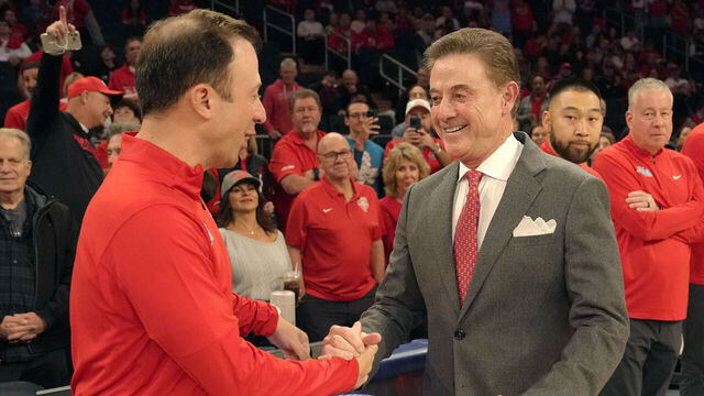 NEW YORK, NY - NOVEMBER 17: Father and sons, head coach Richard Pitino of the New Mexico Lobos and Rick Pitino of St. Johns Red Storm, shake hands prior to during a college basketball game at Madison Square Garden on November 17, 2024 in New York City.