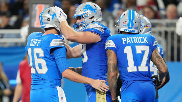 DETROIT, MICHIGAN - NOVEMBER 17: Brock Wright #89 of the Detroit Lions celebrates with Jared Goff #16 after scoring a touchdown in the third quarter of a game against the Jacksonville Jaguars at Ford Field on November 17, 2024 in Detroit, Michigan.
