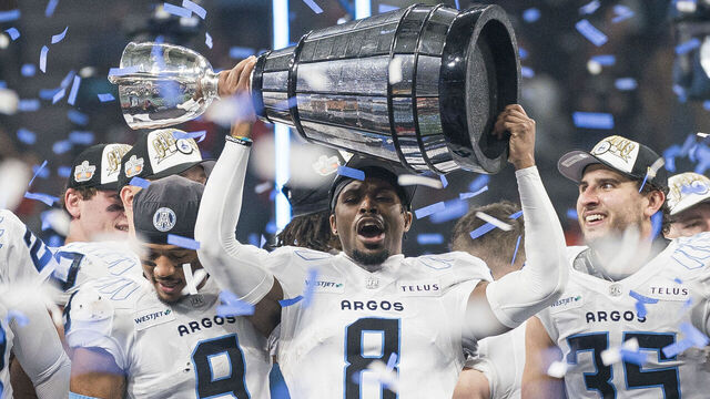 VANCOUVER, CANADA - NOVEMBER 17: DaShaun Amos #8 of the Toronto Argonauts lifts the Grey Cup after defeating the Winnipeg Blue Bombers in the 2024 Grey Cup at BC Place on November 17, 2024 in Vancouver, Canada.
